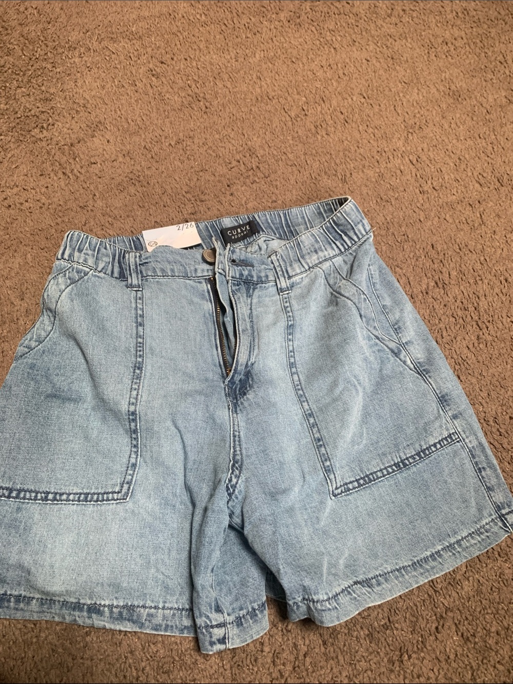 Light Wash Denim Shorts with Front Patch Pockets. Stretch waist